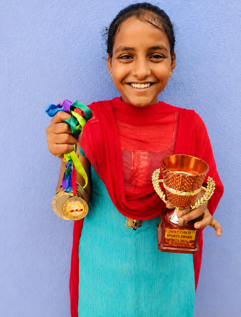 Sports Achievement Nikitha won medals and a trophy at the district-level Kho-Kho competition